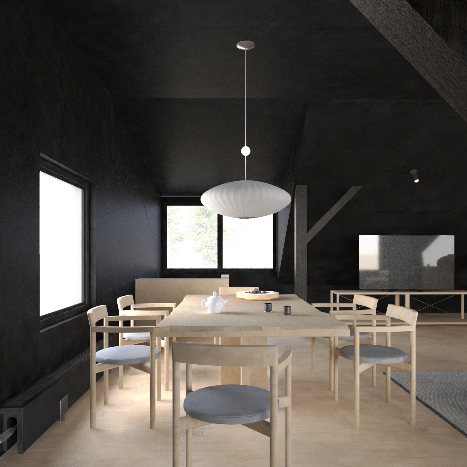 A dark timber dining corner under a dormer window, pale chairs around a raw wood table, a white paper pendant lamp hanging low.