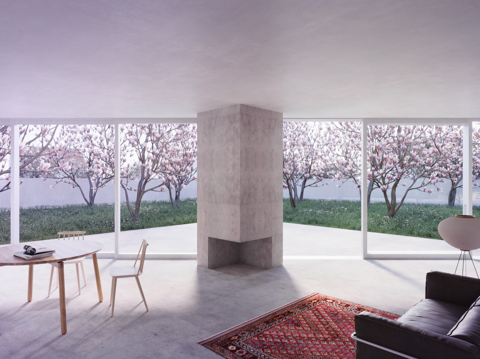 A calm concrete room with a corner fireplace, a worn red oriental rug, and walls of glass onto a garden of blossoming magnolias.