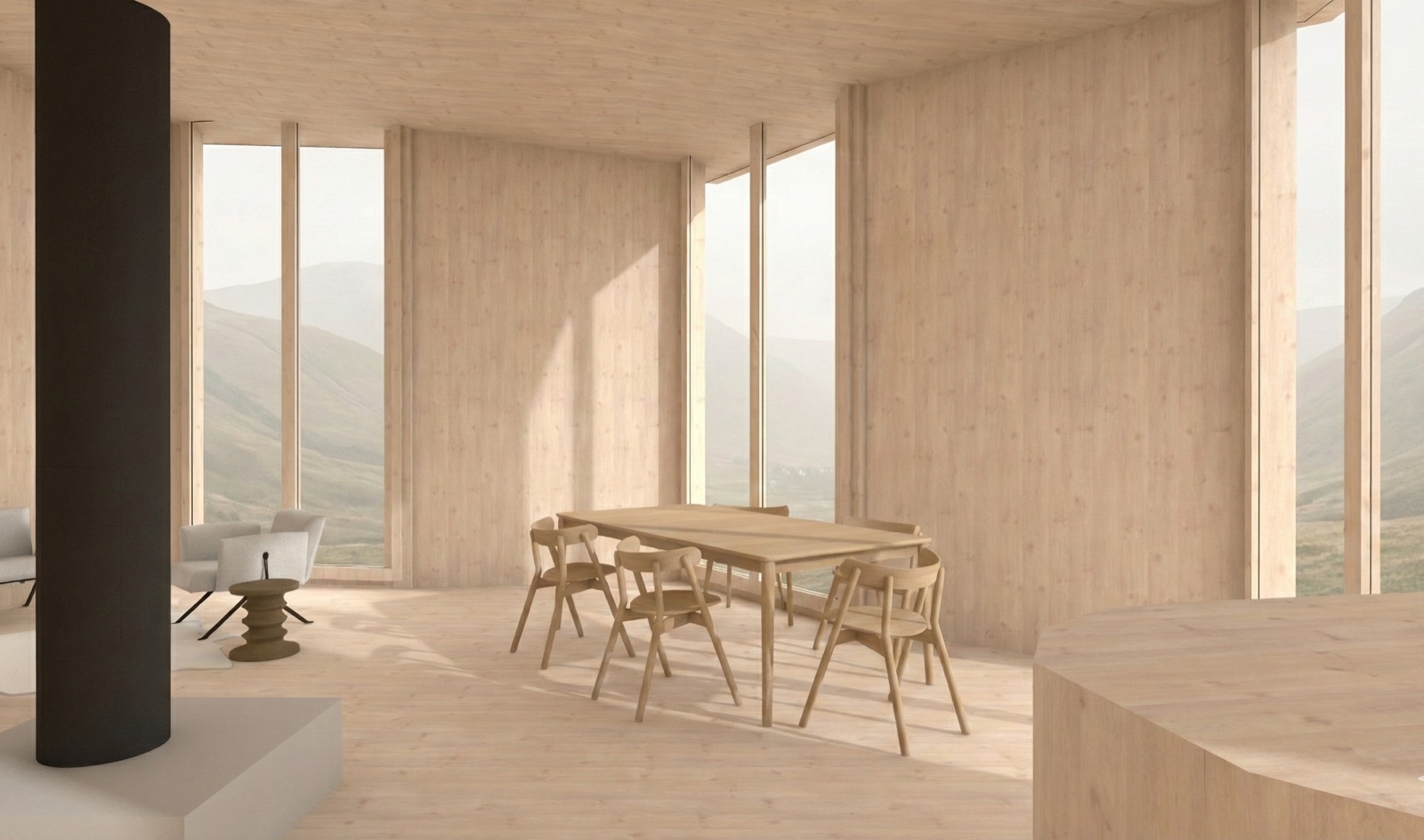 Inside the timber house: a pale wood room with a black stove column, an oak dining table and chairs, and mountain ridges in the tall windows.